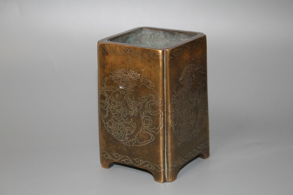 A Chinese bronze and silver inlaid square brush pot, H.10cm